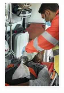Paramedic Helping Man