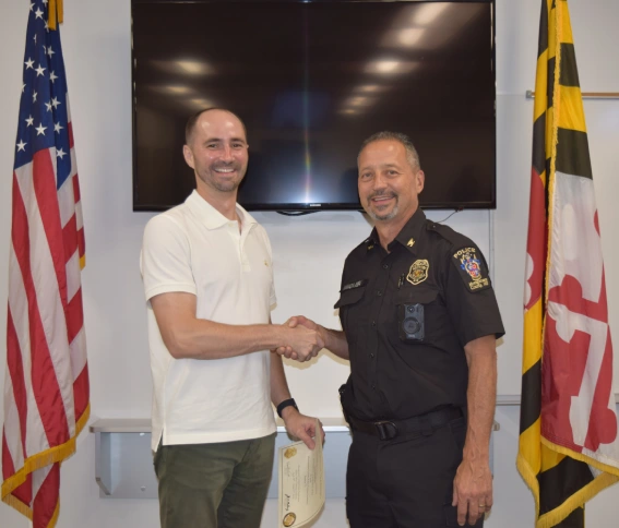 Chris Meadows, President and Owner, Bio-One of Gaithersburg celebrates his Citizen Academy graduation with Chief Yamada of Montgomery County Police. Honoring his commitment to community safety and professional excellence.